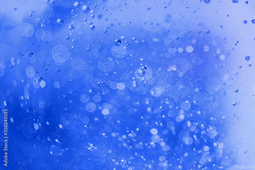 Lot of small bubbles on an blue background, macro shot of liquid soap, macro shot of glass with beer, macro shot of cocktail with fruit juice Lot of small bubbles on an blue background, macro shot of liquid soap, macro shot of glass with beer, macro shot of cocktail with fruit juice