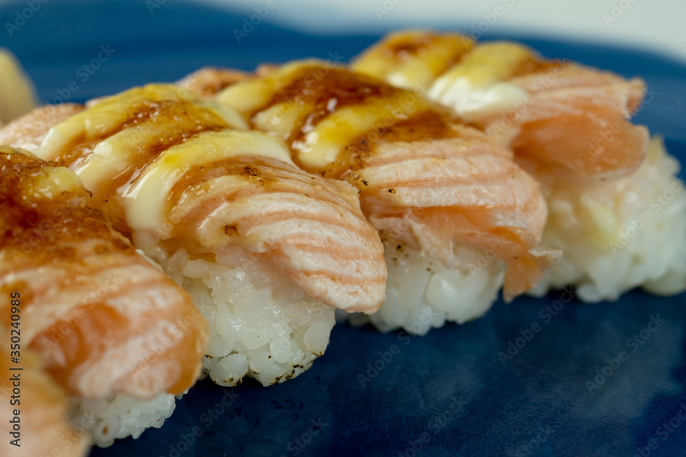 Burn salmon sushi. Selective focus Burn salmon sushi. Selective focus