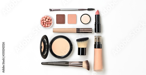 Beauty cosmetic makeup background. Fashion woman make up product, brushes, lipstick, nail polish layout. Creative pink concept. Cosmetology nude make-up accessories, top view.