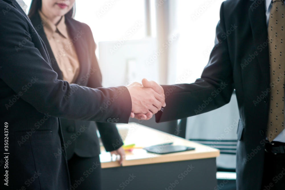 Achievement successful businessmen shaking hands after presentation at conference meeting in office, success teamwork after sign contract, business handshake agreement partnership concept