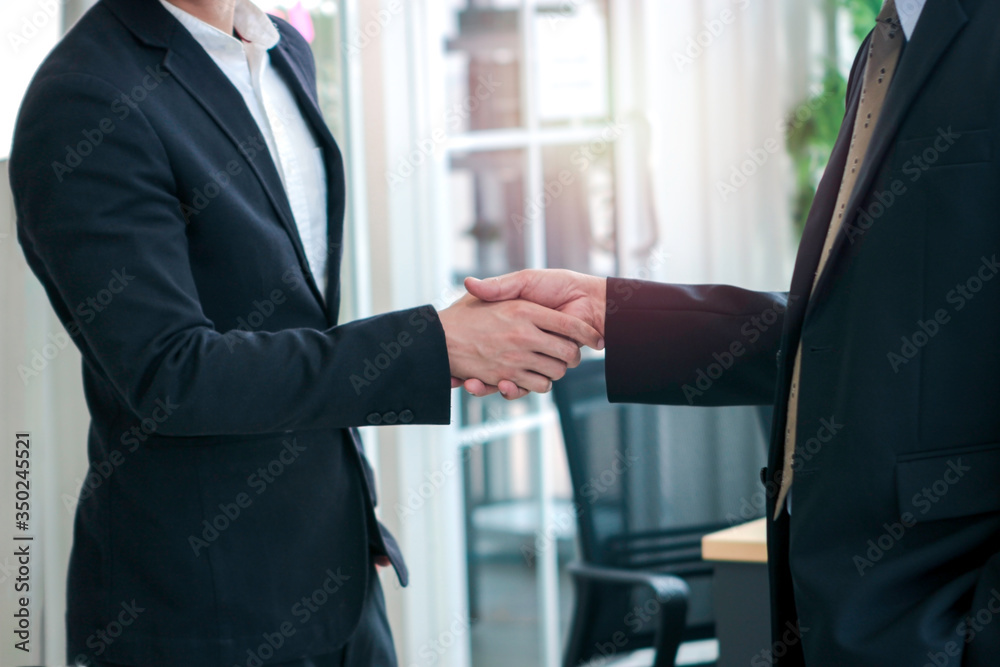 Achievement successful businessmen shaking hands after presentation at conference meeting in office, success teamwork after sign contract, business handshake agreement partnership concept Achievement successful businessmen shaking hands after presentation at conference meeting in office, success teamwork after sign contract, business handshake agreement partnership concept