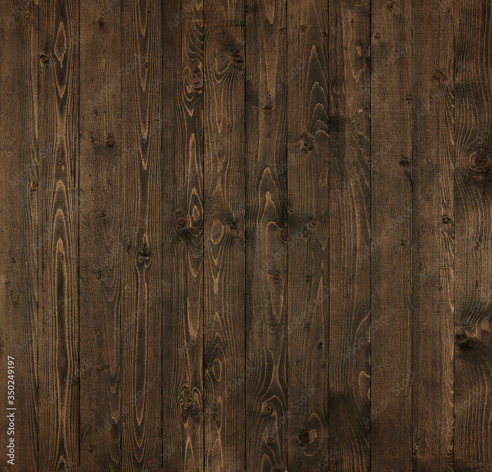 Naklejka premium naturalne tło z ciemnego drewna, deski jako abstrakcyjne tło z pustą przestrzenią jako szablon, struktura drewna