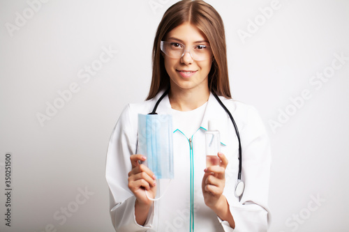 Doctor is holding personal protective equipment against a viral infection