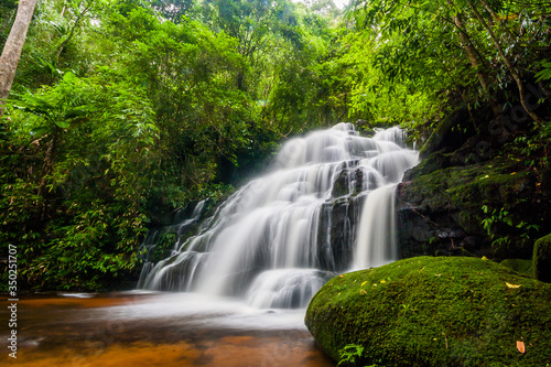Beautiful nature rock waterfall steps. Waterfall in mountain valley with tropical rainforest at Mun Dang Waterfall  Phu Hin Rong Kla National Park  Phetchabun  Thailand.
