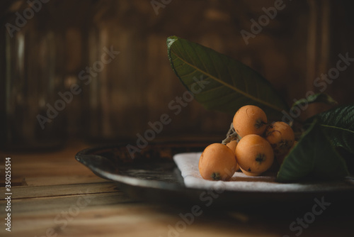 Close up of loquat fruits on plate