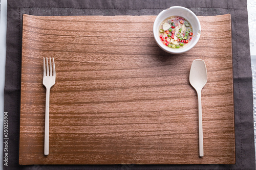 Wooden plate with spoon and fork