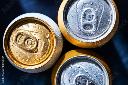 Fototapeta Close-up of three beer cans