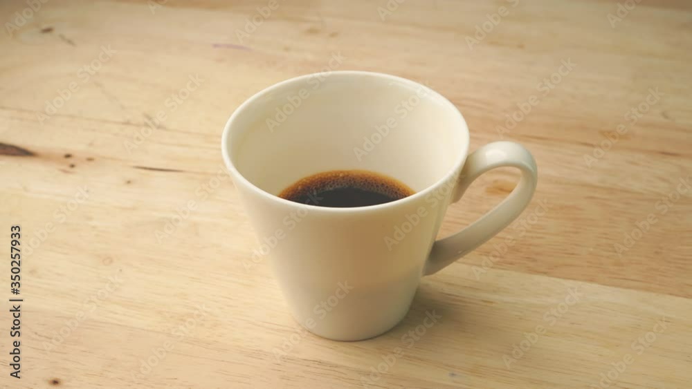 Stop motion drinking hot coffee on wooden table, Orbit rotation camera view
Stop motion drinking hot coffee on wooden table, Orbit rotation camera view