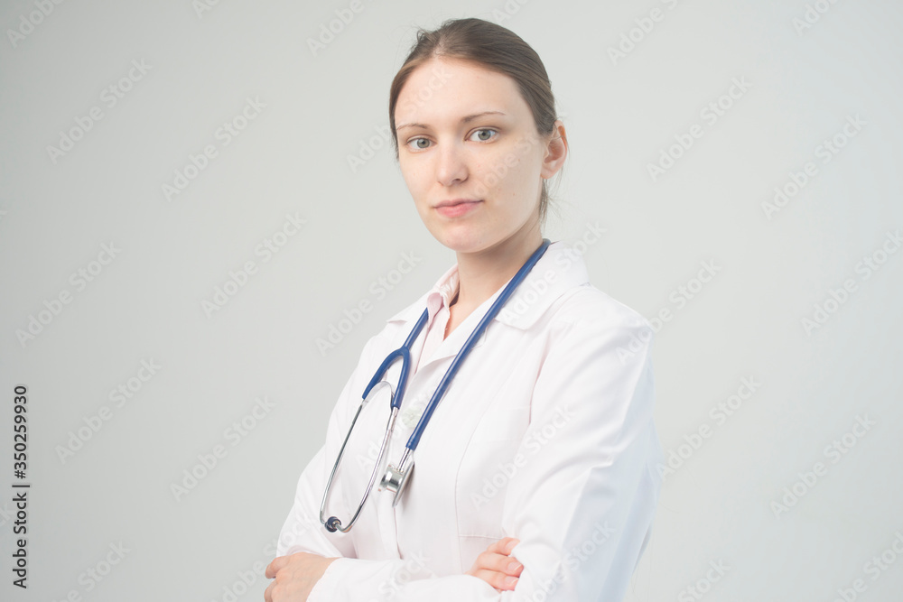 Portrait of an attractive young female doctor in white coat. Portrait of an attractive young female doctor in white coat.