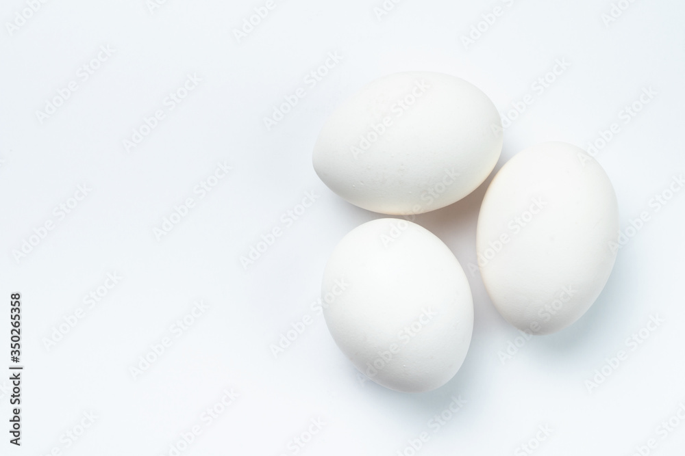 Three white chicken eggs isolated on white background Three white chicken eggs isolated on white background