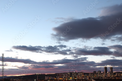 sunset clouds over city