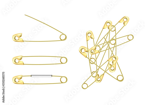 set of gold stainless steel safety  pins, accessory for sewing in different angles, sewing tool for fasten pieces of clothing together.
