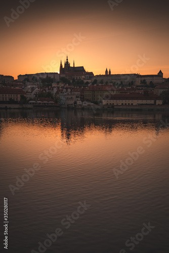 Sunset over Prague castle and Vltava river