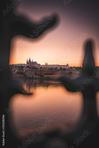 Sunset over Prague castle and Vltava river