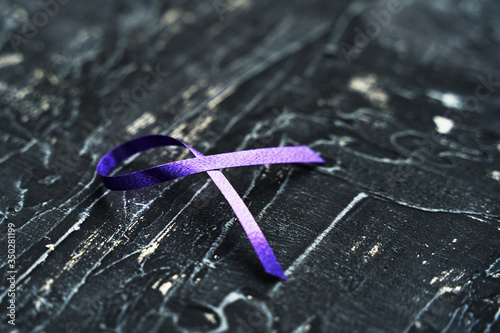 Purple ribbon-symbol of the fight against domestic violence