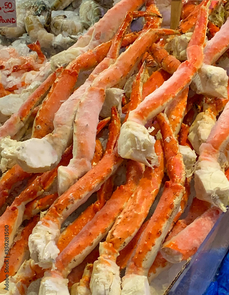 A display of crab legs for sale at market A display of crab legs for sale at market