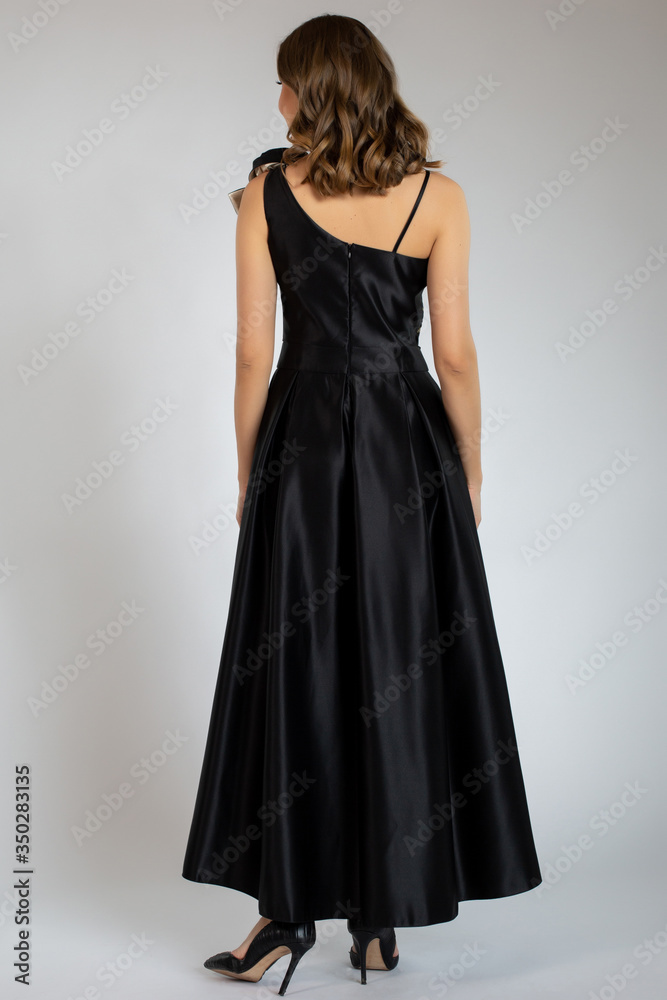 beautiful girl posing in back dress beautiful girl posing in back dress