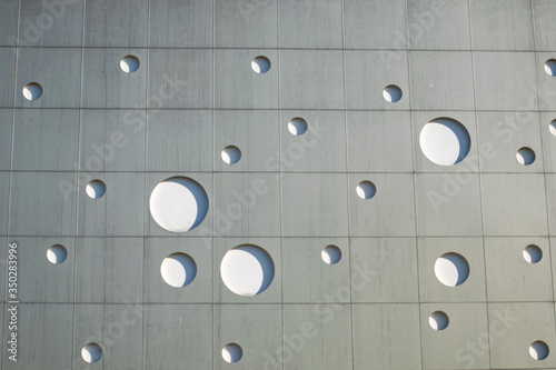 Background texture. wall with round holes in the form of gas bubbles.