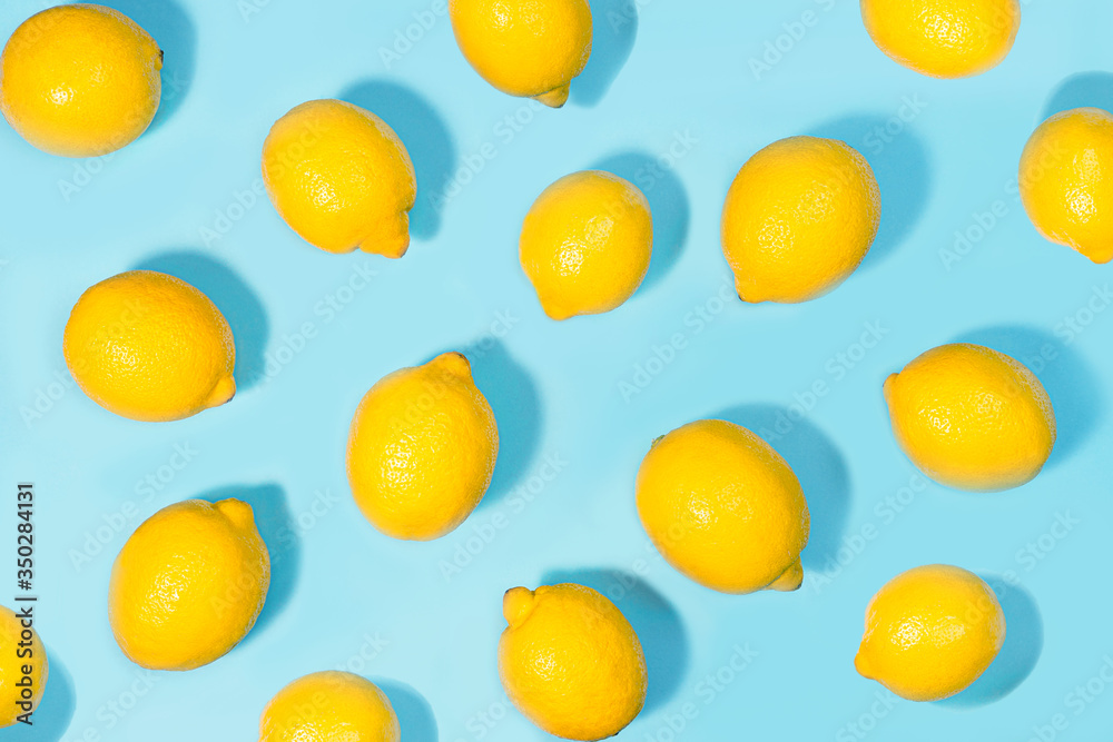 Creative layout made of lemon on green mint color background. Creative layout made of lemon on green mint color background.