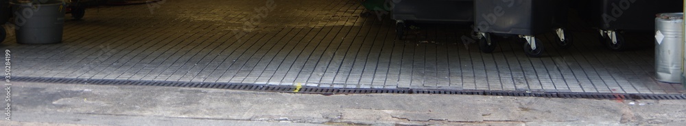 greasy factory floor with small white tiles