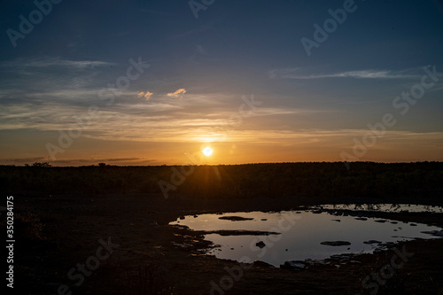 The sun sets at the Moringa Waterhole