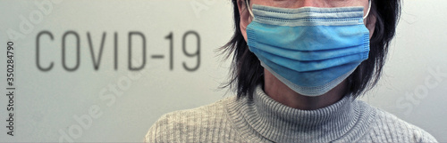 young woman with a medical mask and covid 19 heading