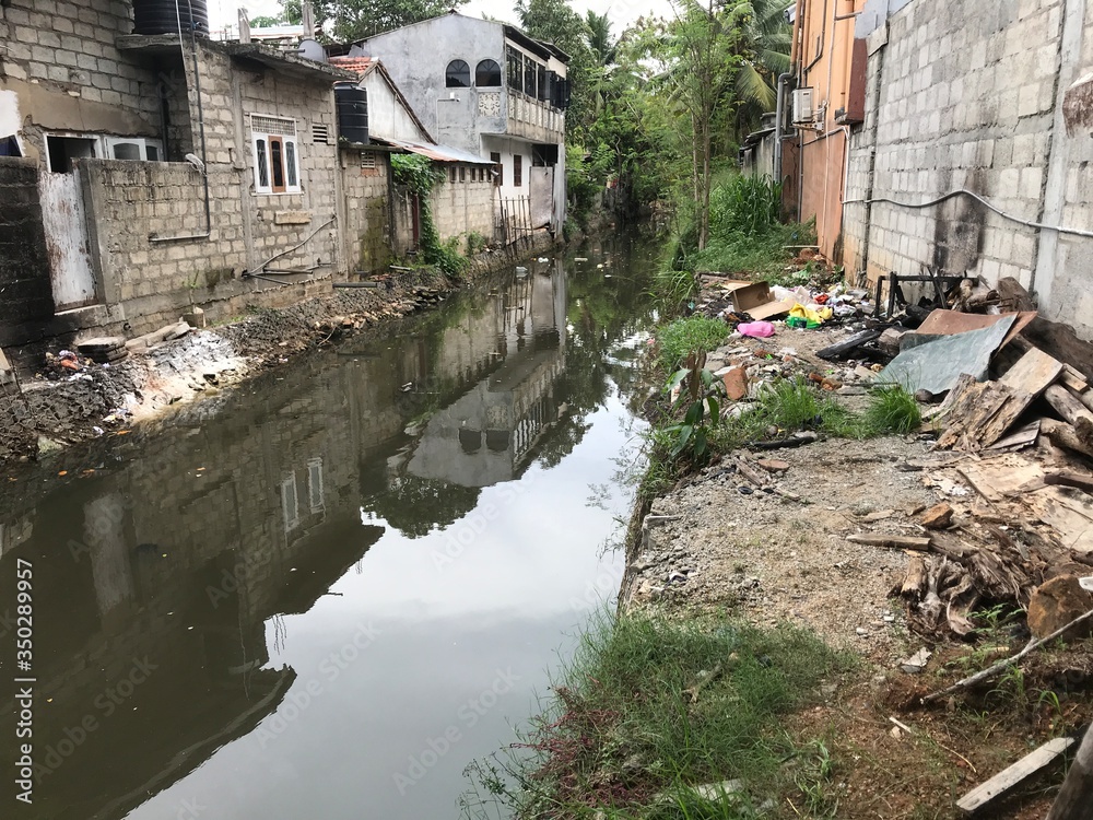Polluted canals view. Buildings reflating through water. Polluted canals view. Buildings reflating through water.