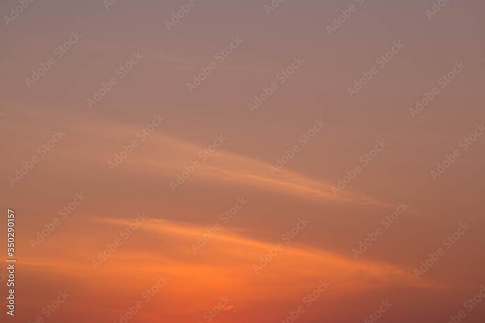Sunset. Texture of a warm orange sky. Space for text.