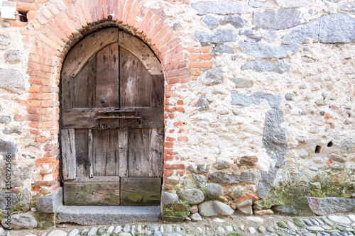 Original medieval wooden door; photo taken in Italy