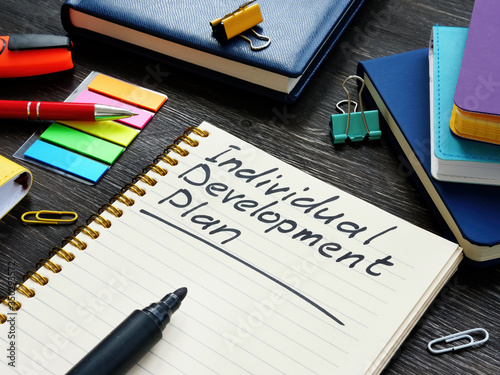 Individual Development Plan IDP on the wooden surface.