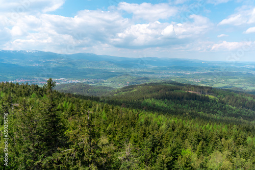 panoramic view of the mountains and forests from the "Skalnik" summit in Poland during the spring afternoon