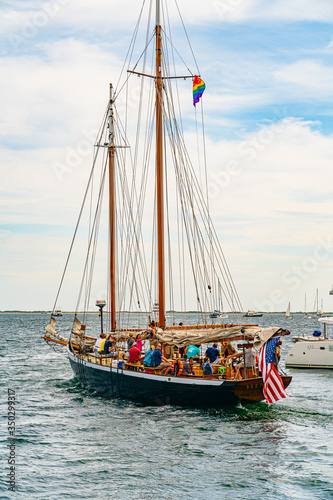 Provincetown, Cape Cod, Massachusetts, US - August 21, 2019 Catamaran and his crew looking for a whale