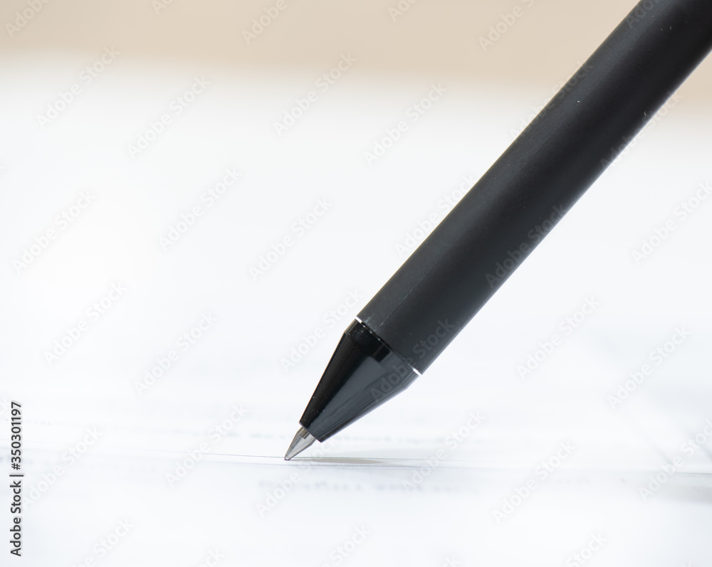 blue pen signing white paper blue pen signing white paper