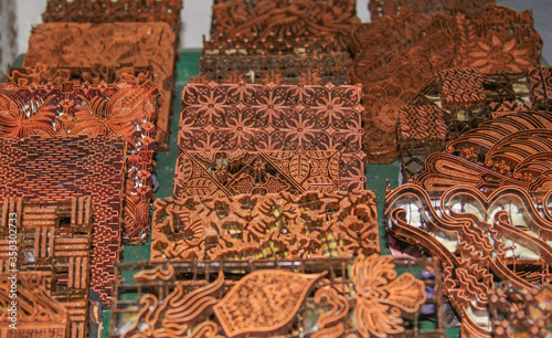 Wax copper stamps at Batik factory in Jogja