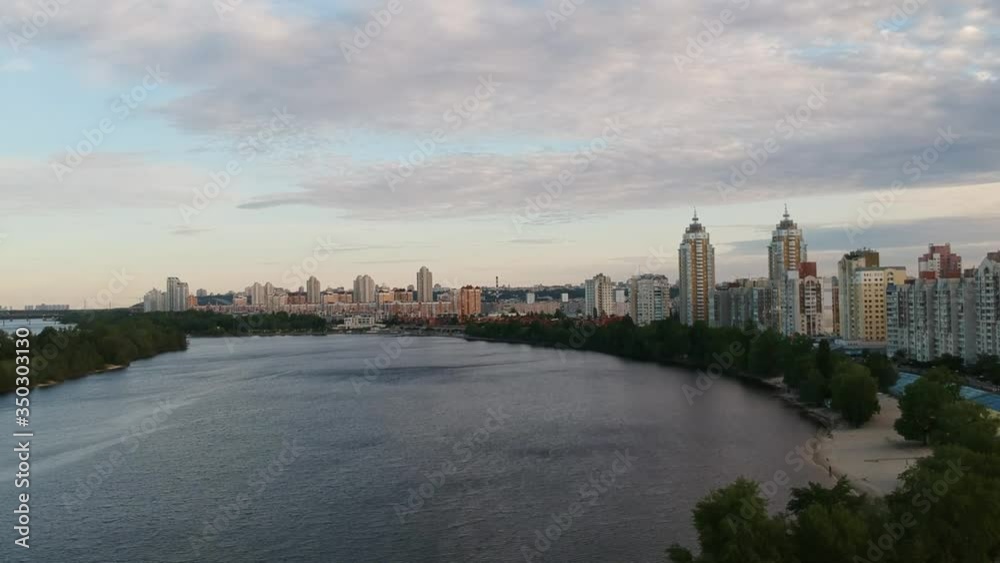 Aerial photography. Obolonskaya embankment in the spring in Kiev. Many houses built along the Dnieper Bay. Drone. Aerial photography. Obolonskaya embankment in the spring in Kiev. Many houses built along the Dnieper Bay. Drone.