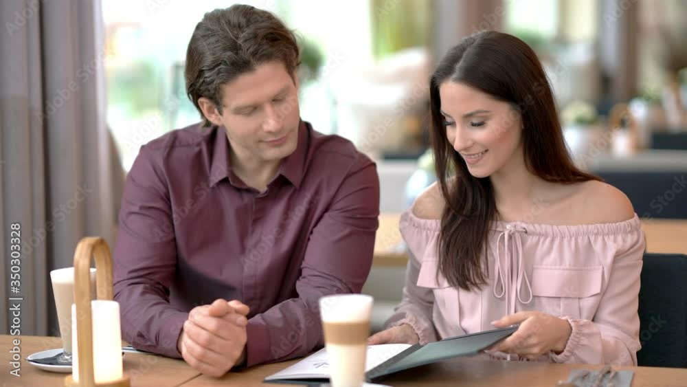Young couple dating in restaurant Young couple dating in restaurant
