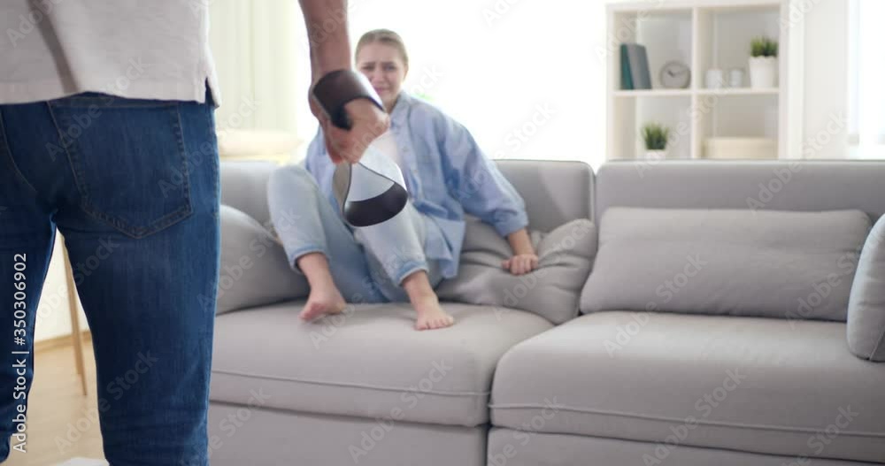 Man threatening his girlfriend in room. Domestic violence Man threatening his girlfriend in room. Domestic violence
