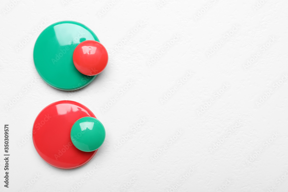 Flat lay composition with colorful magnets on white background, space for text. Pareto principle concept Flat lay composition with colorful magnets on white background, space for text. Pareto principle concept