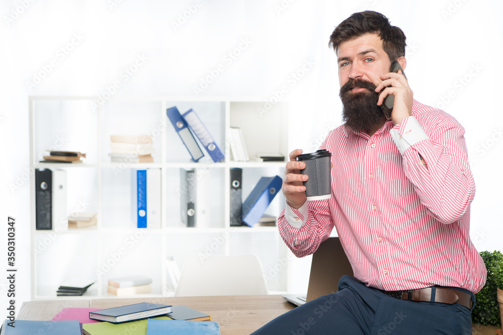 Mobile phone connection. Bearded man talk on phone drinking coffee. Get phone call. Office life. Digital marketing with mobile phone. Business communication. New technology. Modern lifestyle Mobile phone connection. Bearded man talk on phone drinking coffee. Get phone call. Office life. Digital marketing with mobile phone. Business communication. New technology. Modern lifestyle