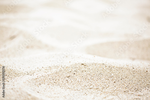 blurred of the sea and sand in the summer for abstract background