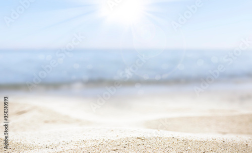 blurred of the sea and sand in the summer for abstract background