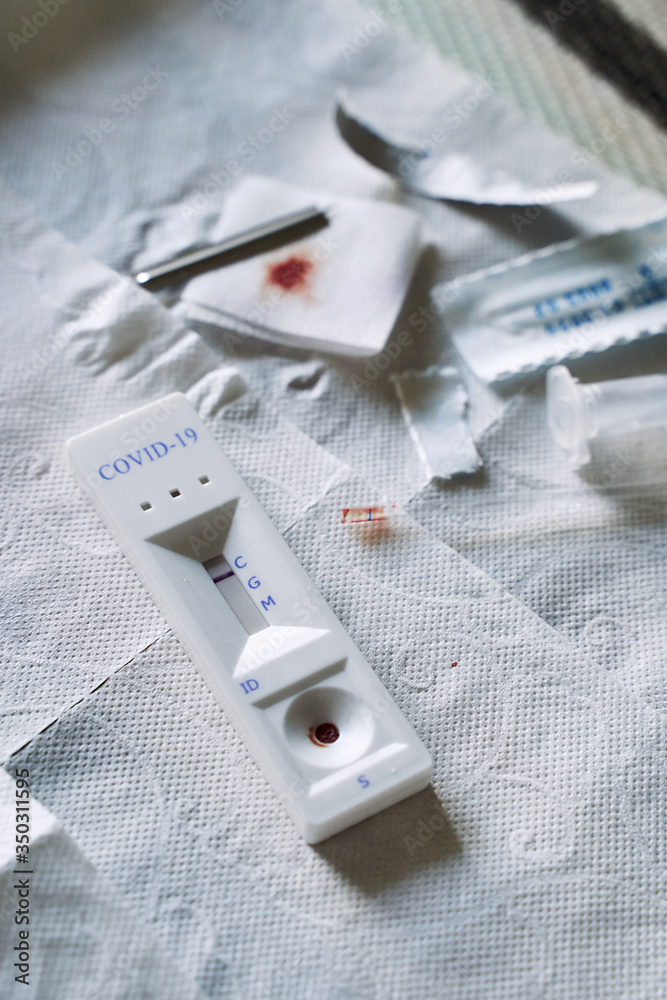 Negative test result by using rapid test device for COVID-19 novel coronavirus on a home kitchen table. Negative test result by using rapid test device for COVID-19 novel coronavirus on a home kitchen table.