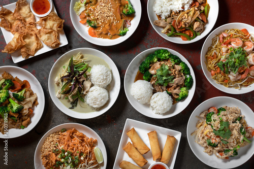 Flat lay of traditional Thai dishes at a South Asian restaurant