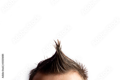 Tableau sur toile A man with a mohawk turned sideways on a white background