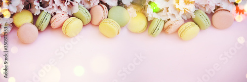 Spring background with blossom and macaroons