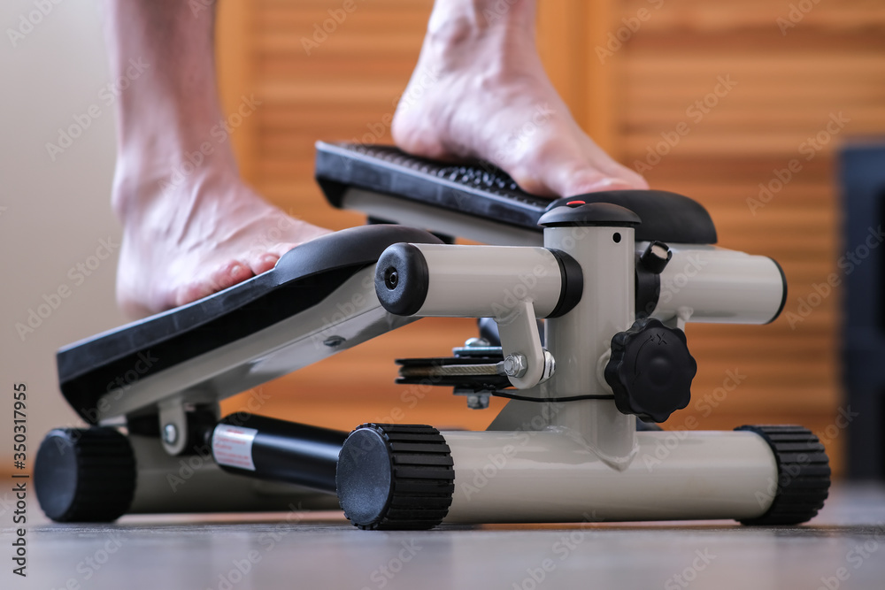 Machine Foot Step Modifiaction Image Leg training. The feet of the feet press on the pedals of the ...