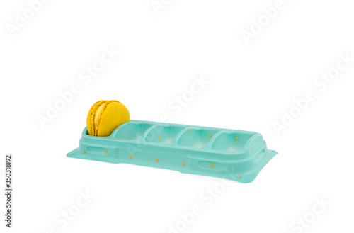 Yellow macaroon in a box