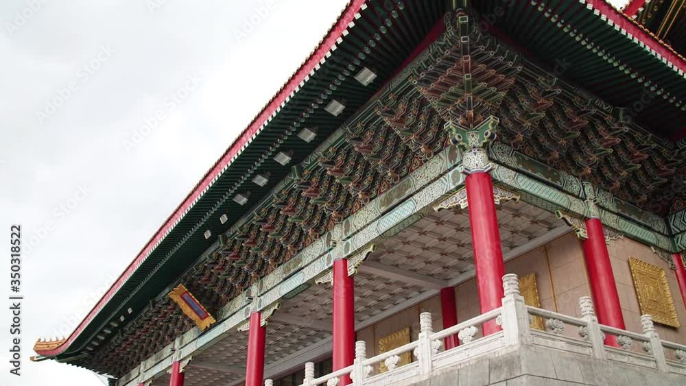 Traditional Chinese roof decorations and architecture at Concert Hall in Chiang Kai Shek Memorial, Taipei, Taiwan.
High angle, panoramic movement, slow motion, HD. Traditional Chinese roof decorations and architecture at Concert Hall in Chiang Kai Shek Memorial, Taipei, Taiwan.
High angle, panoramic movement, slow motion, HD.
