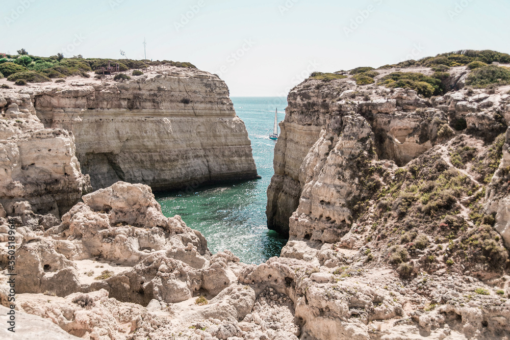 beach and rocks and sea, white, cave, cliff