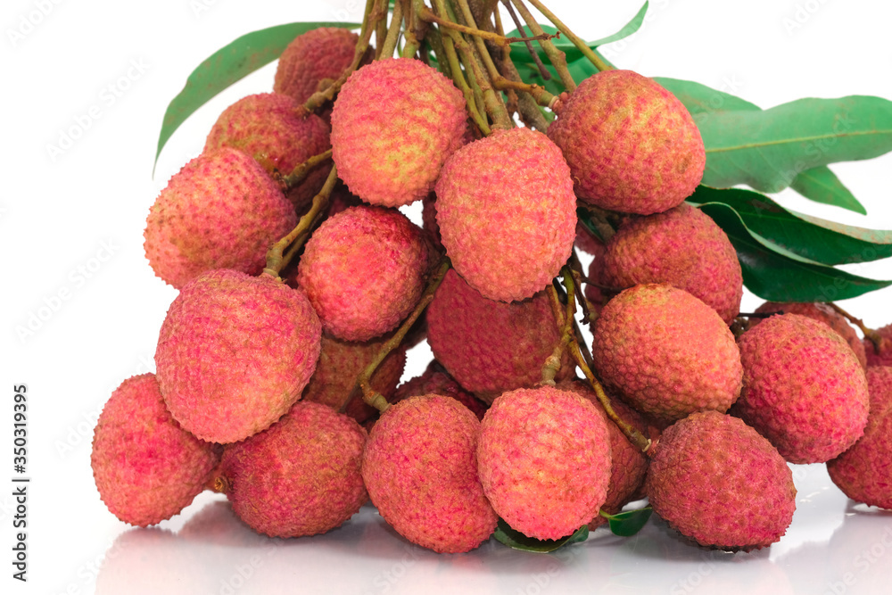 fresh group red lychee sweet fruits with green leaf. Isolated on white background. circle surface grunge texture. fresh group red lychee sweet fruits with green leaf. Isolated on white background. circle surface grunge texture.